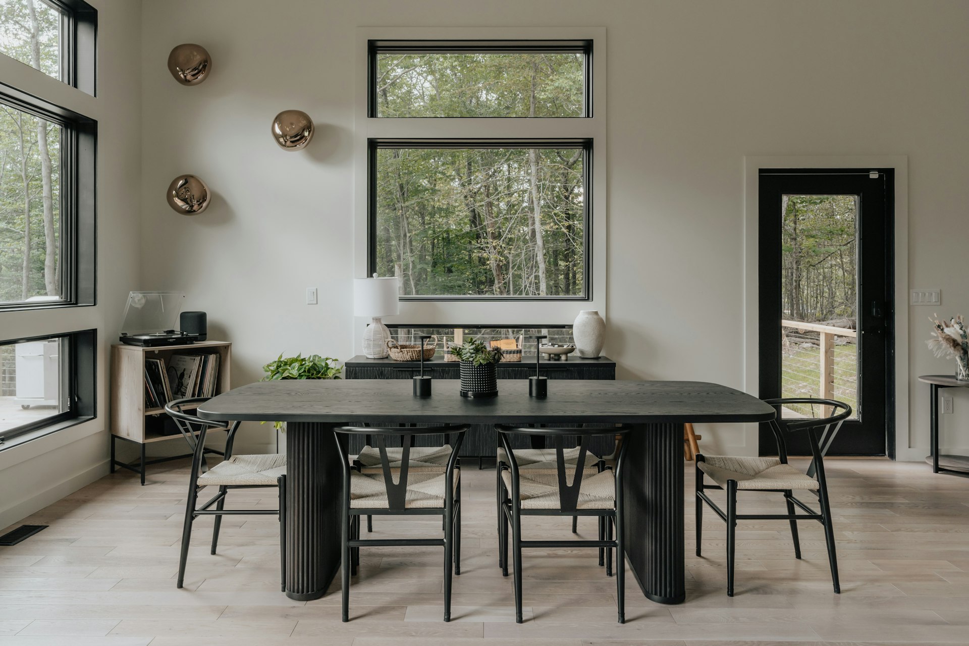 A dining room with a table and chairs